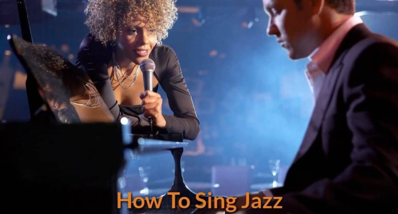 A jazz singer is singing with a singing with piano accompaniment.