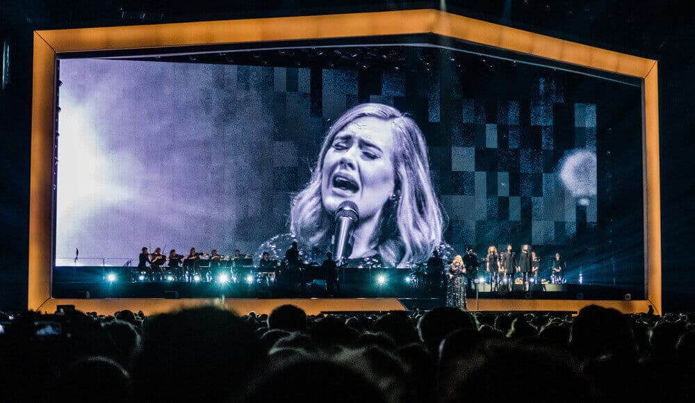Adele singing on stage.