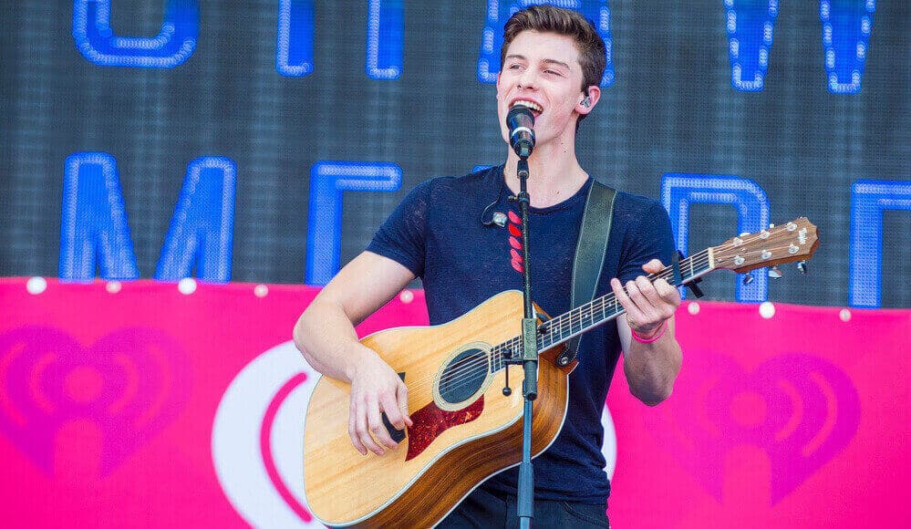 Shawn Mendes singing in the concert.